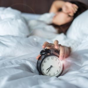 This is a clock on a bed to show sleep